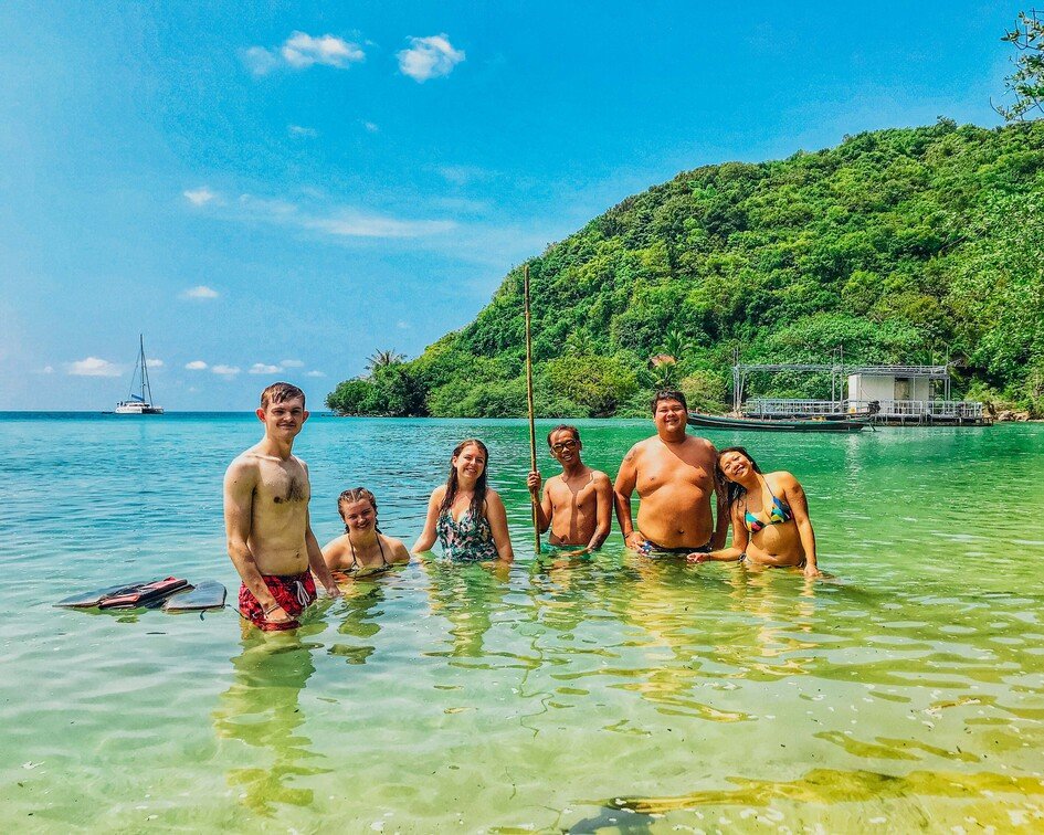 A group in the clear turquoise water in Railay beach, Krabi, Thailand 